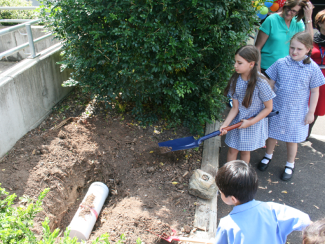 Students helped to bury the time capsule 