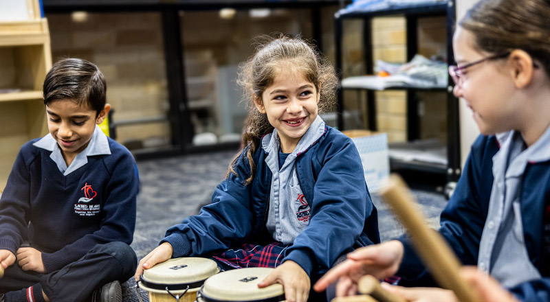 Sacred Heart Catholic Primary School Westmead students learning percussion instruments
