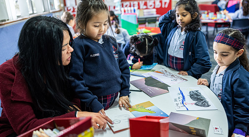 Dedicated teacher from Sacred Heart Catholic Primary School Westmead aiding students in literacy