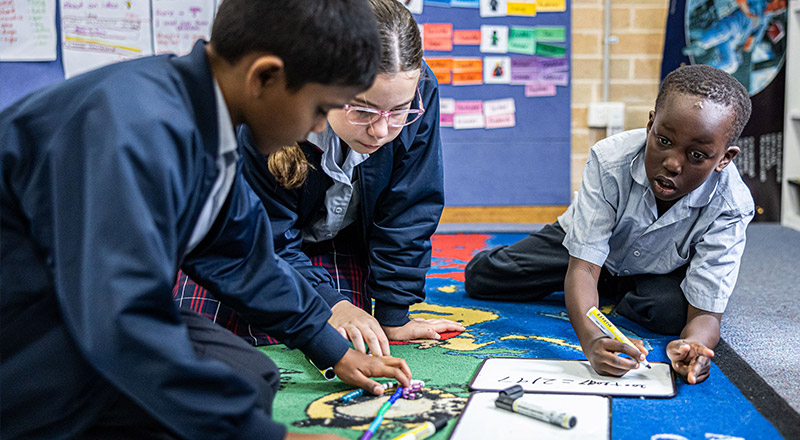 Sacred Heart Catholic Primary School Westmead students learning on rug