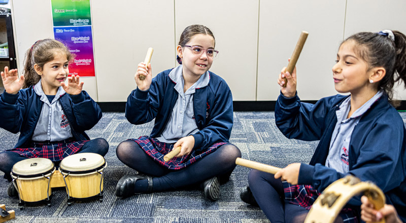 Sacred Heart Catholic Primary School Westmead students learning percussion instruments
