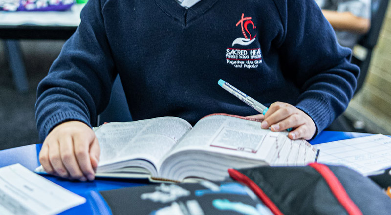 Sacred Heart Catholic Primary School Westmead student reading bible