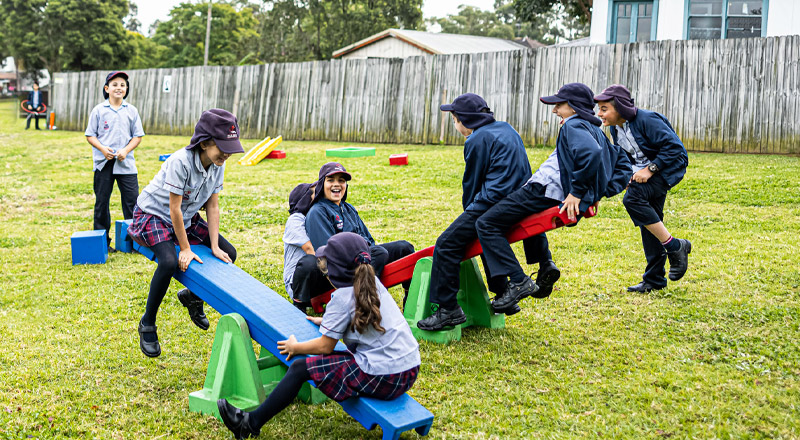 Sacred Heart Catholic Primary School Westmead students playing on the lawn