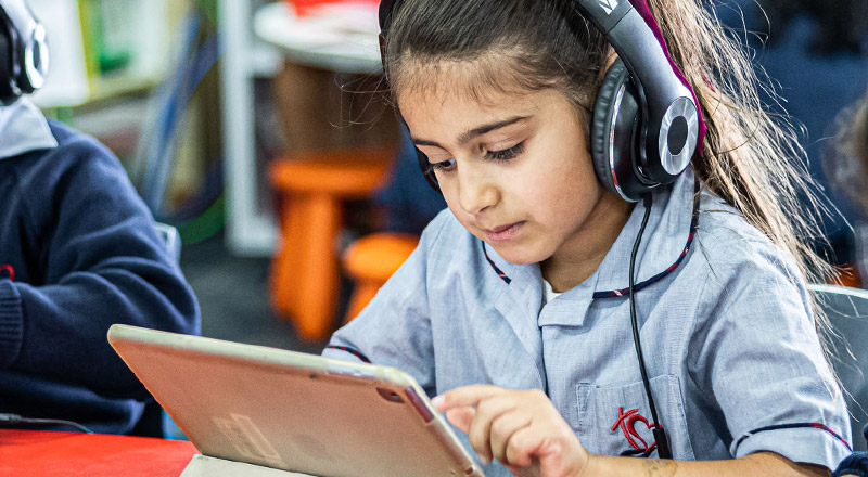 Sacred Heart Catholic Primary School Westmead student with headphones on