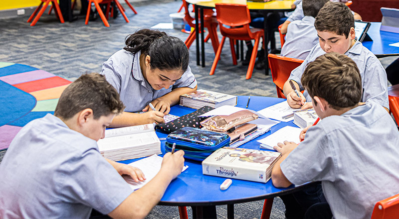 Sacred Heart Catholic Primary School Westmead students sitting at desk