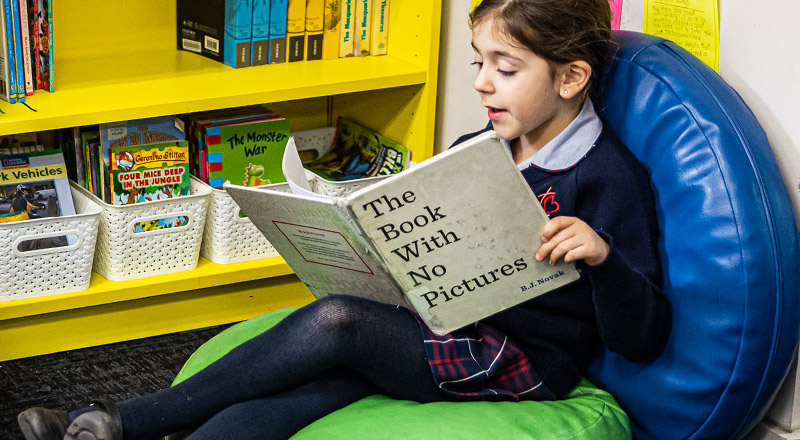 Sacred Heart Catholic Primary School Westmead student reading book