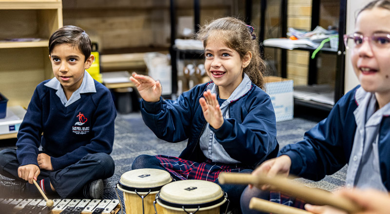 Sacred Heart Catholic Primary School Westmead students learning percussion instruments