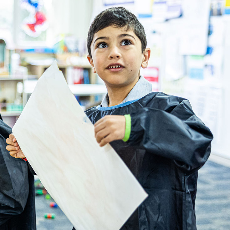 Sacred Heart Catholic Primary School Westmead student holding painting