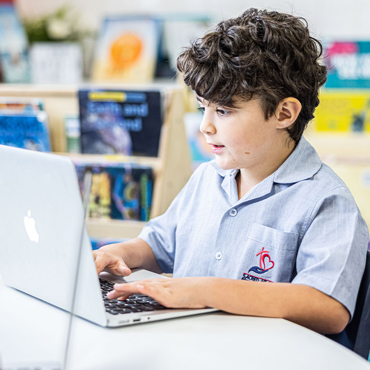 Sacred Heart Catholic Primary School Westmead student on laptop
