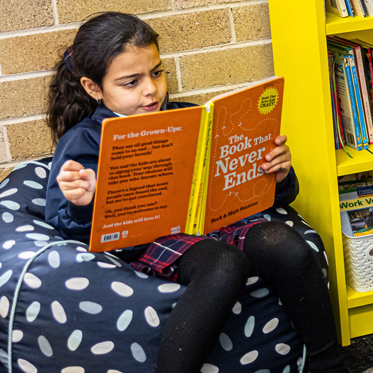 Sacred Heart Catholic Primary School Westmead student reading a book
