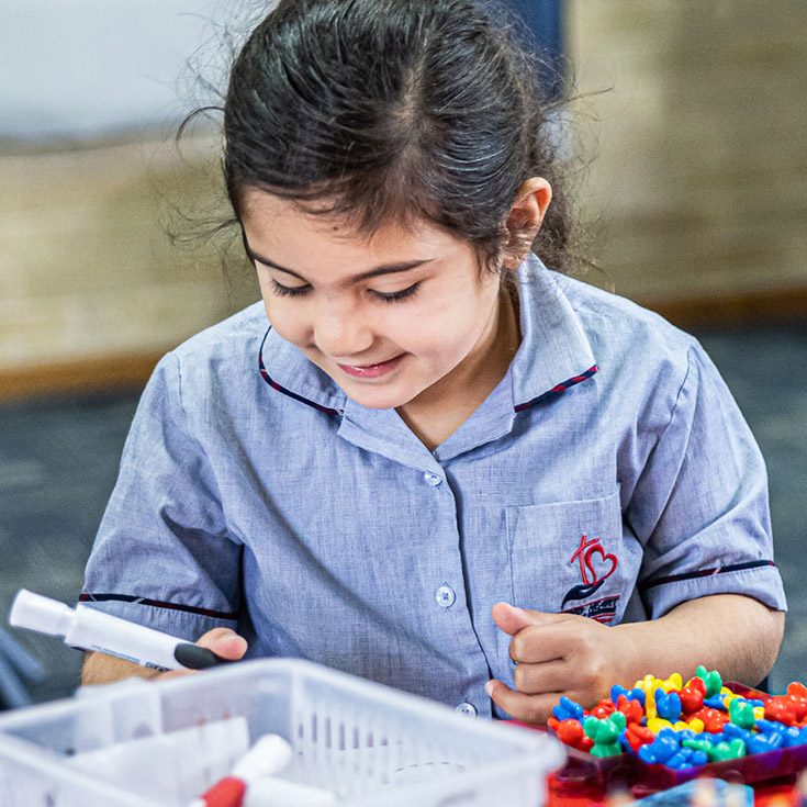 Sacred Heart Catholic Primary School Westmead student looking down at work