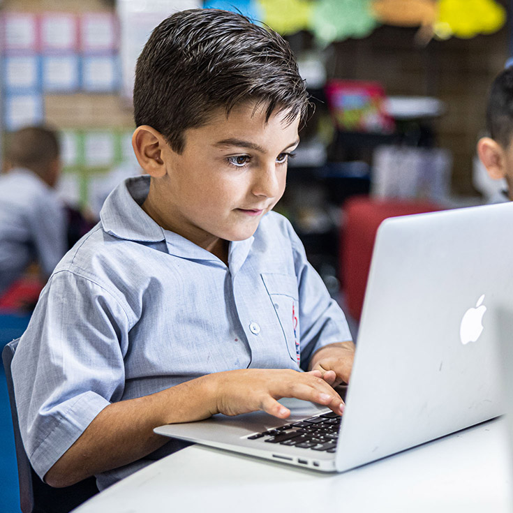 Sacred Heart Catholic Primary School Westmead student on laptop