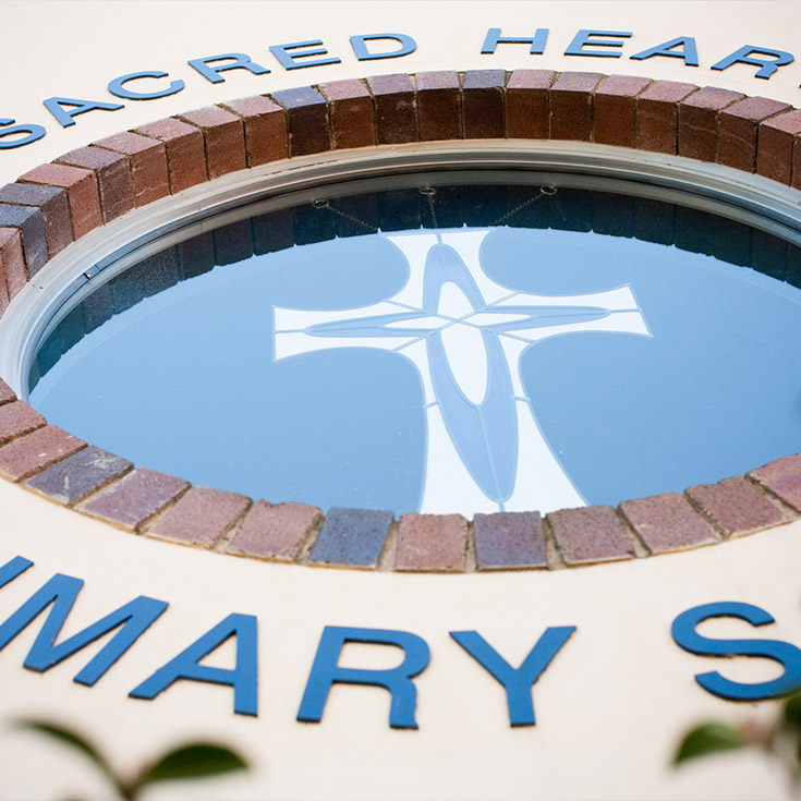Sacred Heart Catholic Primary School Westmead exterior window with school name as border
