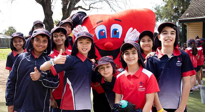Sacred Heart Catholic Primary Westmead students with school mascot